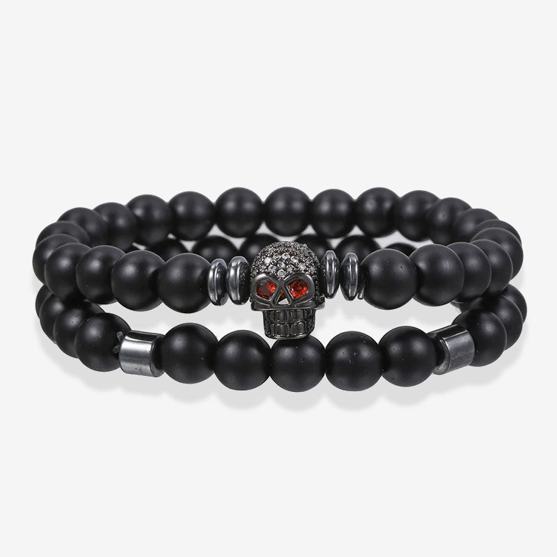 Bracelet 2 pièces en cuivre avec perles noires givrées et tête de mort