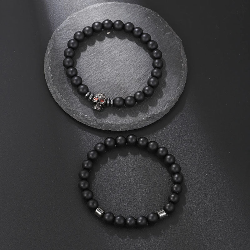 Bracelet 2 pièces en cuivre avec perles noires givrées et tête de mort