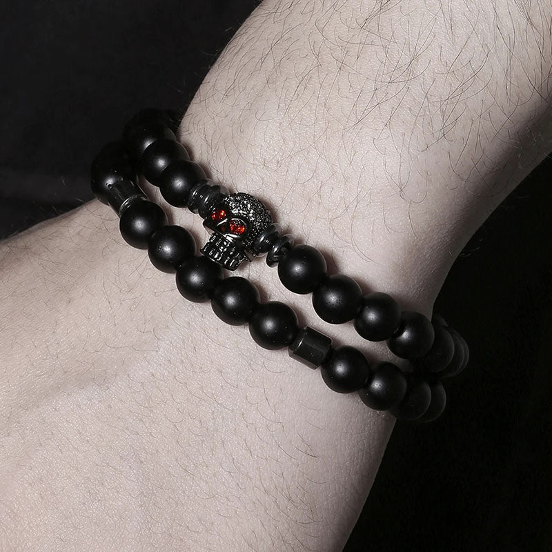 Bracelet 2 pièces en cuivre avec perles noires givrées et tête de mort