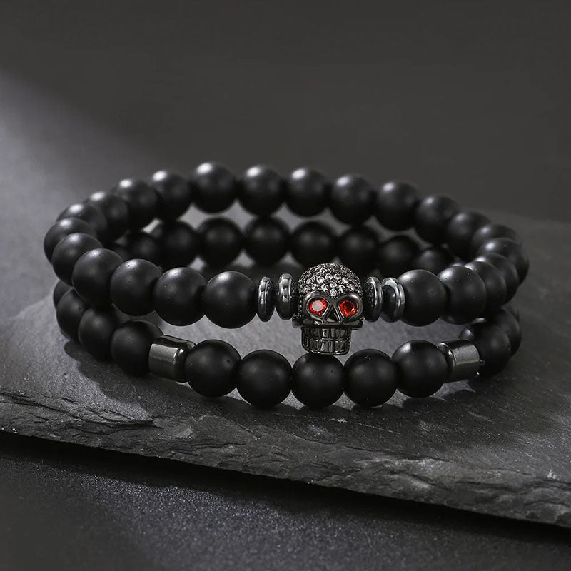 Bracelet 2 pièces en cuivre avec perles noires givrées et tête de mort